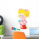 Girl playing with her doll Wall Decal