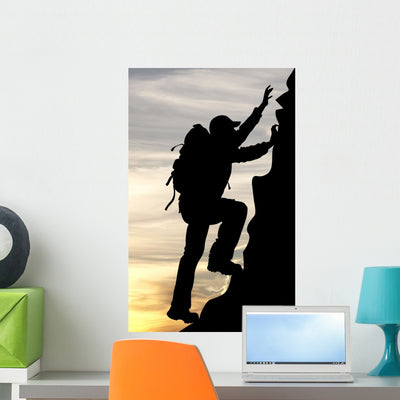 Silhouette Traveler Tourist Mountaineer shown on a wall