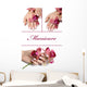 collage.Beautiful hand with perfect manicure and purple orchid f Wall Mural