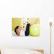 Beauty, young girl behooves gym exercise with ball Wall Mural