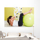 Beauty, young girl behooves gym exercise with ball Wall Mural