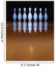 Old, battered bowling pins in dark background Wall Mural