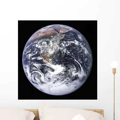 Earth from Outer Space Wall Mural shown on a wall