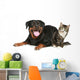 Rottweiler and cat lies on a white background Wall Decal