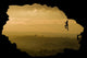 Two rock climbers silhouette against stunning sunset landscape c Wall Mural