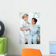 Nurse helps a patient to get up in hospital Wall Mural