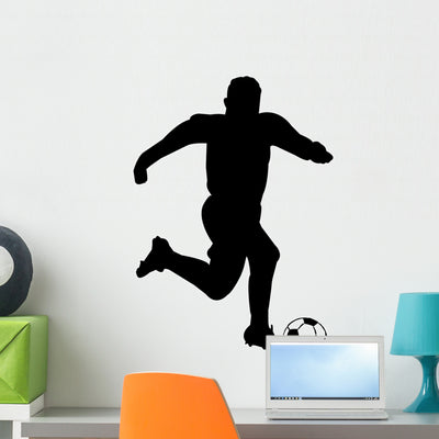 Soccer Silhouettes shown on a wall