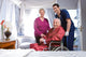 Elder Couple with Assistant