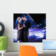 Handsome young couple dancing on the street and smiling Wall Mural