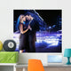 Handsome young couple dancing on the street and smiling Wall Mural