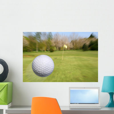 Flying Golf Ball Wall Mural shown on a wall