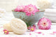 Spa scene with pink  flowers in water Wall Mural