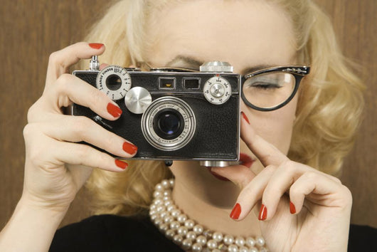 Woman Holding Vintage Camera Wall Mural