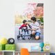 Teen boy with disabled little brother in walker Wall Mural