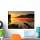 Boat on the shore of a misty lake Wall Mural