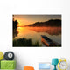 Boat on the shore of a misty lake Wall Mural