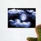 The moon in the night sky in clouds Wall Mural