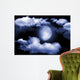 The moon in the night sky in clouds Wall Mural