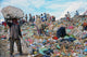 poor people working in a rubbish dump Wall Mural