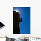 Rock climber clinging to a cliff. Wall Mural