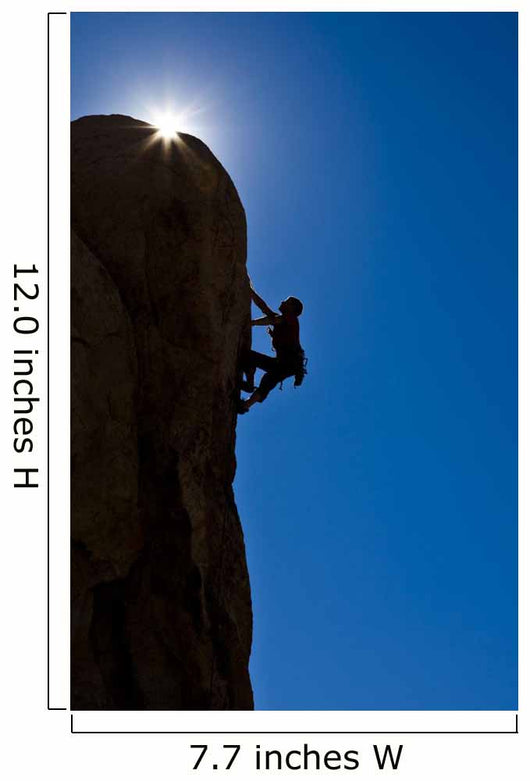 Rock climber clinging to a cliff. Wall Mural