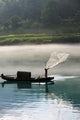 Fisherman Casting Net River