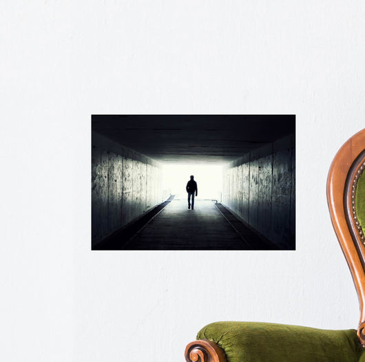 Silhouette of Man Walking in Tunnel Wall Mural