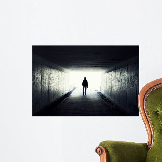 Silhouette of Man Walking in Tunnel Wall Mural