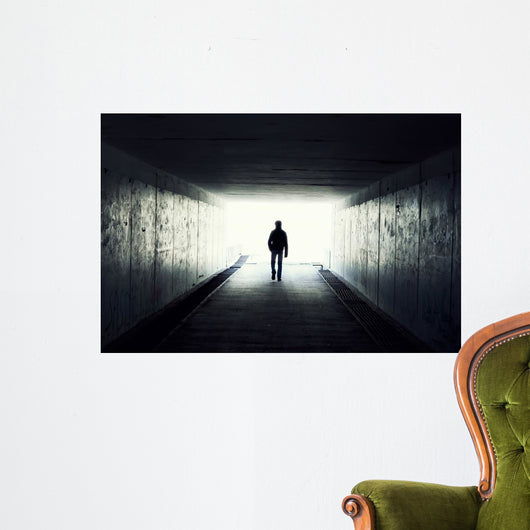 Silhouette of Man Walking in Tunnel Wall Mural