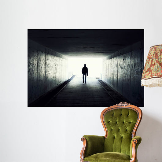 Silhouette of Man Walking in Tunnel Wall Mural
