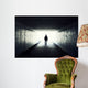 Silhouette of Man Walking in Tunnel Wall Mural