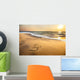 Om symbol on the beach Wall Mural