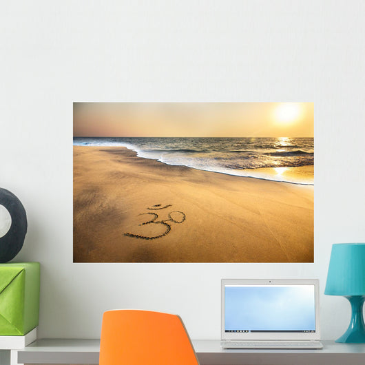 Om symbol on the beach Wall Mural