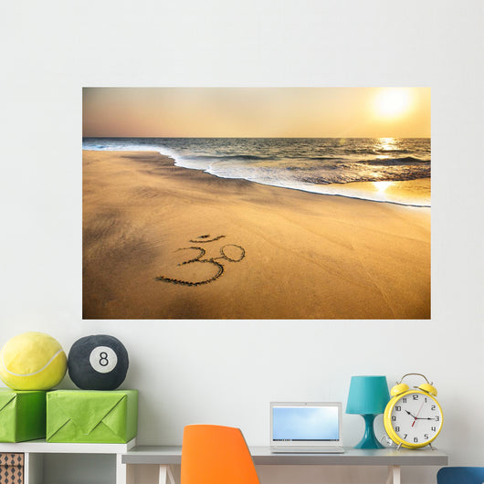 Om symbol on the beach Wall Mural