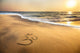 Om symbol on the beach Wall Mural