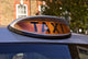 taxi for hire light, london Wall Mural
