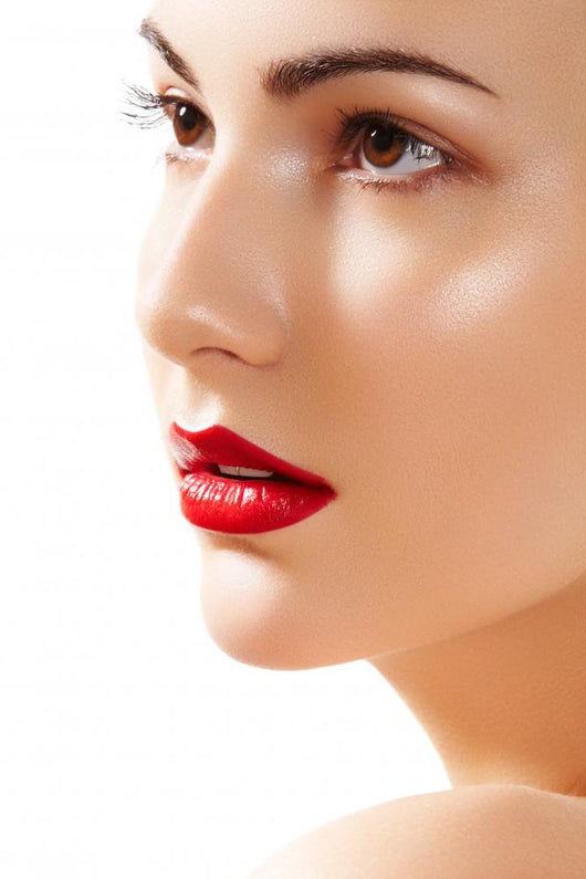 Portrait of beautiful woman purity face with bright lips make-up Wall Mural