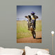 motocross rider on back wheel Wall Mural