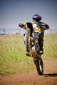 motocross rider on back wheel Wall Mural
