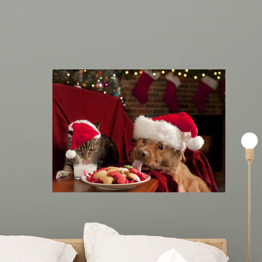 Cat and Dog Devouring Santas Cookies Wall Mural