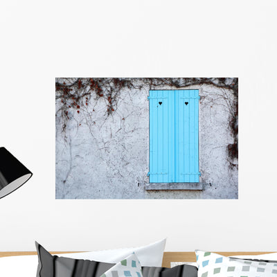 Window with Blue Shutters shown on a wall