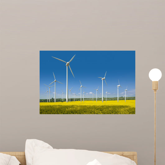 Wind turbines in a rapeseed field Wall Mural