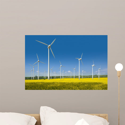 Wind turbines in a rapeseed field Wall Mural