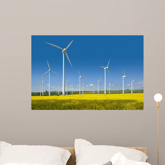 Wind turbines in a rapeseed field Wall Mural