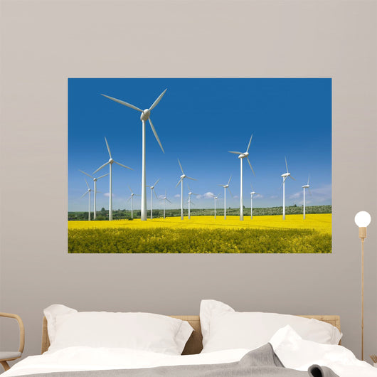 Wind turbines in a rapeseed field Wall Mural