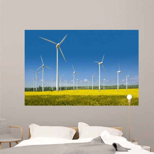Wind turbines in a rapeseed field Wall Mural