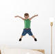 happy little boy with hands in air Wall Decal