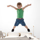 happy little boy with hands in air Wall Decal