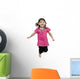 Adorable little girl jumping in air. isolated on white backgrou Wall Decal