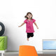 Adorable little girl jumping in air. isolated on white backgrou Wall Decal